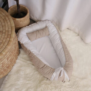 Printed baby nest / baby pod with matching pillow in Beige tones, offering a cozy, secure space for newborns – part of a handcrafted South African nursery set. Cinnamon and Spice