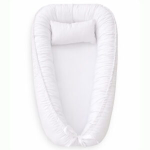 Handmade baby nest pod with cushioned edges in light beige, designed for newborn comfort and safe lounging.