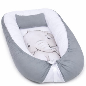 Handmade baby nest pod with cushioned edges in light beige, designed for newborn comfort and safe lounging.