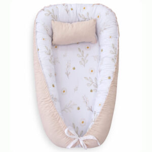 Handmade baby nest pod with cushioned edges in light beige, designed for newborn comfort and safe lounging.