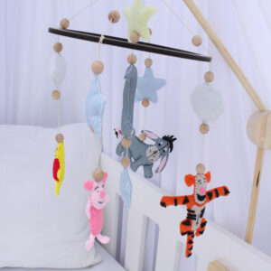 Winnie the Pooh themed cot mobile with handcrafted characters, perfect for adding classic charm to your baby’s nursery – Cinnamon and Spice Baby Boutique.