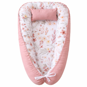 Handmade baby nest pod with cushioned edges in Soft Boho Floral Dusty Pink, designed for newborn comfort and safe lounging.