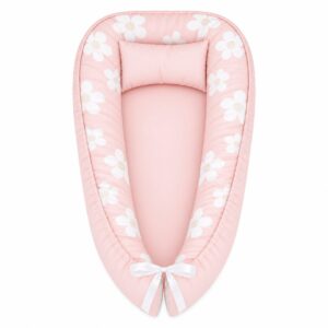 Plain Field Of Daisy baby nest with padded raised sides and a small matching head pillow, designed to create a cozy, secure sleeping space for infants.