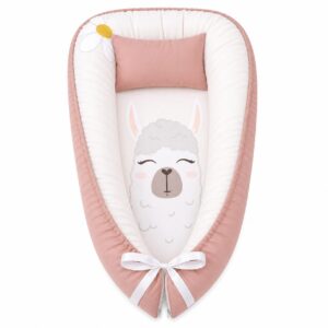 Boho Daisy Llama baby nest with padded raised sides and a small matching head pillow, designed to create a cozy, secure sleeping space for infants.