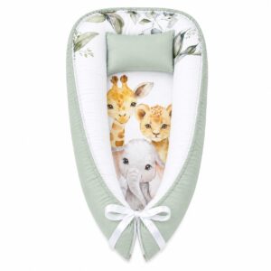 Safari and Friends with Pennygum baby nest with padded raised sides and a small matching head pillow, designed to create a cozy, secure sleeping space for infants.