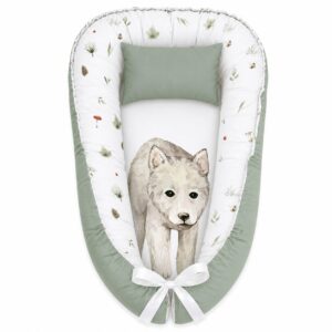 The Cutest Wolf baby nest with padded raised sides and a small matching head pillow, designed to create a cozy, secure sleeping space for infants.