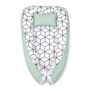 Sage Green With Pattern On White baby nest with padded raised sides and a small matching head pillow, designed to create a cozy, secure sleeping space for infants.