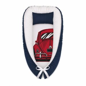 VW Bug City Life Beetle Vintage baby nest with padded raised sides and a small matching head pillow, designed to create a cozy, secure sleeping space for infants.