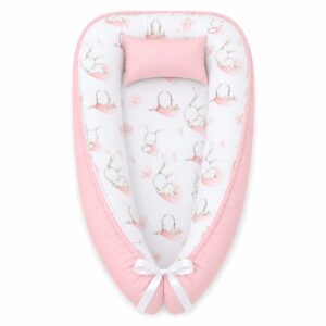 Long Eared White Bunny Patchwork baby nest with padded raised sides and a small matching head pillow, designed to create a cozy, secure sleeping space for infants.