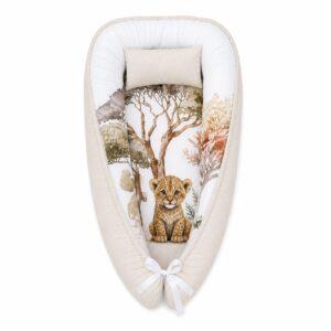 Safari Beige Splash baby nest with padded raised sides and a small matching head pillow, designed to create a cozy, secure sleeping space for infants.