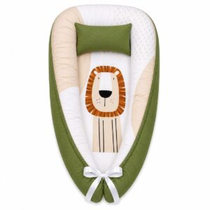 Boho Emerald Sitting Lion with Rainbow baby nest with padded raised sides and a small matching head pillow, designed to create a cozy, secure sleeping space for infants.