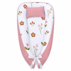 Pink Little Flower baby nest with padded raised sides and a small matching head pillow, designed to create a cozy, secure sleeping space for infants.