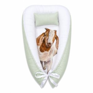 Green Boerbok Goat baby nest with padded raised sides and a small matching head pillow, designed to create a cozy, secure sleeping space for infants.