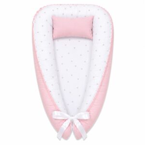 Minimalistic Pink Beige Dotty baby nest with padded raised sides and a small matching head pillow, designed to create a cozy, secure sleeping space for infants.