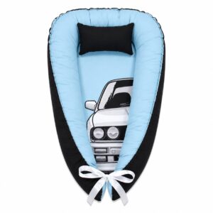 BMW E30 baby nest with padded raised sides and a small matching head pillow, designed to create a cozy, secure sleeping space for infants.