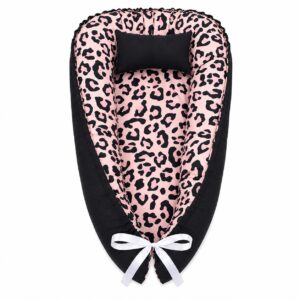 Pink Leopard Print Break baby nest with padded raised sides and a small matching head pillow, designed to create a cozy, secure sleeping space for infants.