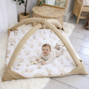 Handcrafted beige baby playmat with hot air balloon print, perfect for tummy time – Cinnamon and Spice Baby Boutique.