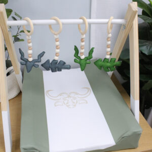Handcrafted wooden baby gym with neutral tones and soft hanging toys, designed for sensory development and motor skills – locally made in South Africa. Ideal for changing tables and baby development. Hunting Theme. Buck
