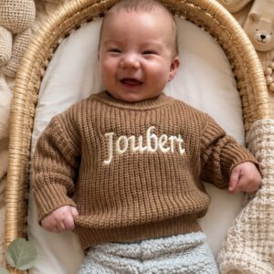 Knitted baby jersey in natural tones with custom hand-embroidered name, handmade in South Africa