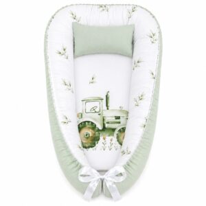 Farm Tractor And Leaf baby nest with padded raised sides and a small matching head pillow, designed to create a cozy, secure sleeping space for infants.
