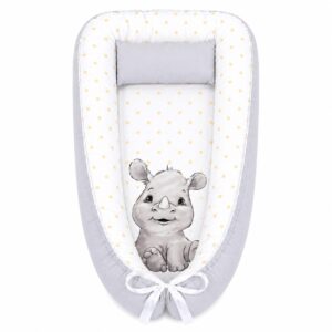 Yellow Grey Monochrome Rhino baby nest with padded raised sides and a small matching head pillow, designed to create a cozy, secure sleeping space for infants.