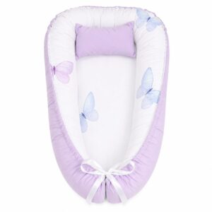 World of Pastel Butterflies baby nest with padded raised sides and a small matching head pillow, designed to create a cozy, secure sleeping space for infants.
