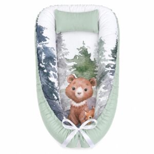 Monochrome Sage Woodlands Dotted baby nest with padded raised sides and a small matching head pillow, designed to create a cozy, secure sleeping space for infants.