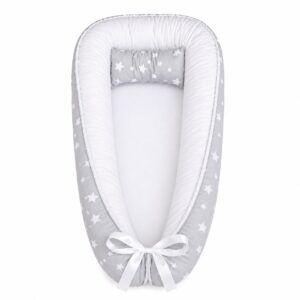 Light Grey with White Stars baby nest with padded raised sides and a small matching head pillow, designed to create a cozy, secure sleeping space for infants.