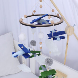Green and blue cot mobile for baby boys, handcrafted with soft tones for a calming nursery – Cinnamon and Spice Baby Boutique.