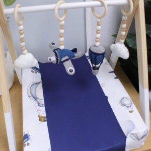 Natural wooden baby gym with minimalist wooden dangles hanging from frame. Brand: Cinnamon and Spice