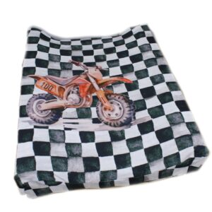 Soft changing mat cover with checkered dirt bike print customized print, designed for gentle comfort and easy cleaning – a handcrafted touch for your South African nursery. Cinnamon and Spice Baby room