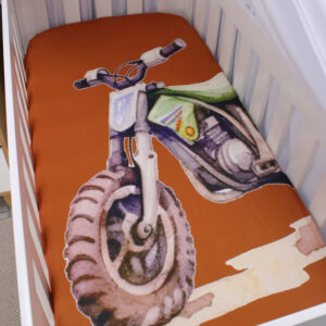 Rust-coloured baby cot fitted sheet with dirt bike design handcrafted by Cinnamon and Spice South Africa