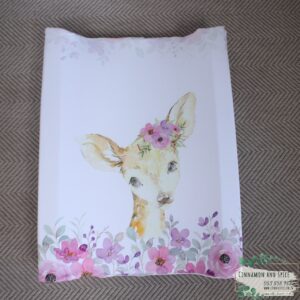 Neutral-toned changing mat cover with sage rainbow and sun motif—soft stretchy fabric for stylish and comfy diaper changes.