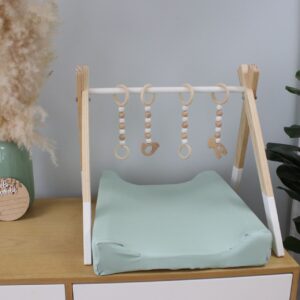 Neutral-toned changing mat cover with sage rainbow and sun motif—soft stretchy fabric for stylish and comfy diaper changes.