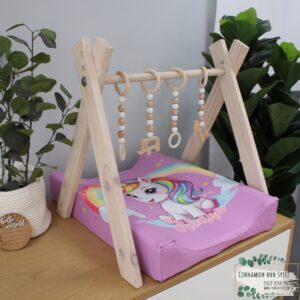 Neutral-toned changing mat cover with sage rainbow and sun motif—soft stretchy fabric for stylish and comfy diaper changes.