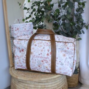 Personalised floral duffel bag with tan leather straps, perfect for baby travel or weekend getaways. Personalization is free. Cinnamon and Spice