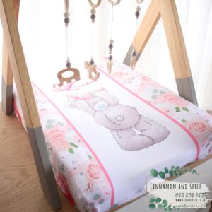 Neutral-toned changing mat cover with sage rainbow and sun motif—soft stretchy fabric for stylish and comfy diaper changes.