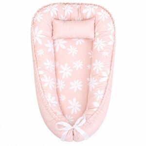 Light Pink Daisy Flower baby nest with padded raised sides and a small matching head pillow, designed to create a cozy, secure sleeping space for infants.