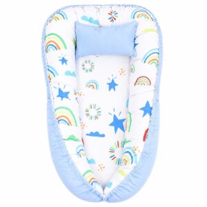 Colourful Rainbow In The Sky baby nest with padded raised sides and a small matching head pillow, designed to create a cozy, secure sleeping space for infants.