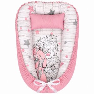 Pink Starry Tatty Teddy Sleeping baby nest with padded raised sides and a small matching head pillow, designed to create a cozy, secure sleeping space for infants.