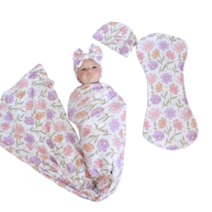 Handcrafted wrap set, perfect for swaddling baby and helps reduce the startle reflex, promoting longer, more restful sleep for your baby in a South African-inspired nursery. Cinnamon and Spice. Featuring Pink And Purple Drawing Flower print
