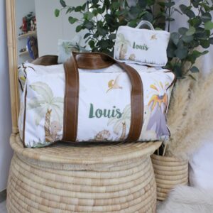 Custom duffel bag for kids with dinosaur print, handcrafted with durable, easy-clean fabric and soft carry handles—ideal for travel, school, or sleepovers.