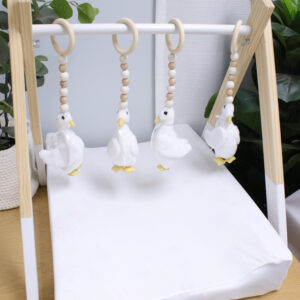 Natural wooden baby gym with minimalist wooden dangles hanging from frame. Brand: Cinnamon and Spice