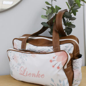 A personalised floral diaper bag with leather handles and personalized with name detail, handcrafted for moms in South Africa. Cinnamon and Spice