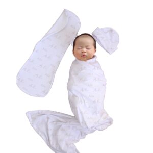 Handcrafted wrap set, perfect for swaddling baby and helps reduce the startle reflex, promoting longer, more restful sleep for your baby in a South African-inspired nursery. Cinnamon and Spice. Featuring Dusty Beige Name Wrap print