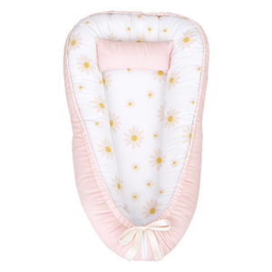 Light Pink Daisies baby nest with padded raised sides and a small matching head pillow, designed to create a cozy, secure sleeping space for infants.