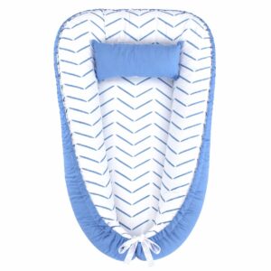 Ocean Blue Herringbone baby nest with padded raised sides and a small matching head pillow, designed to create a cozy, secure sleeping space for infants.