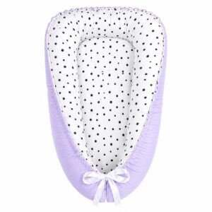 Purple with Black Spots baby nest with padded raised sides and a small matching head pillow, designed to create a cozy, secure sleeping space for infants.
