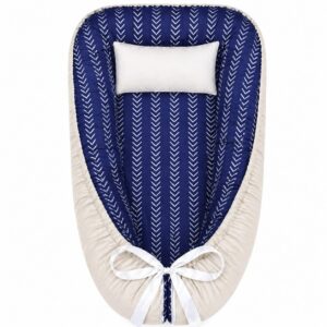 Beige and Blue Ocean Air Balloon Herringbone baby nest with padded raised sides and a small matching head pillow, designed to create a cozy, secure sleeping space for infants.