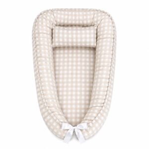 Beige Checkered baby nest with padded raised sides and a small matching head pillow, designed to create a cozy, secure sleeping space for infants.